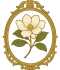 Elegant magnolia flower framed in a vintage gold oval frame.